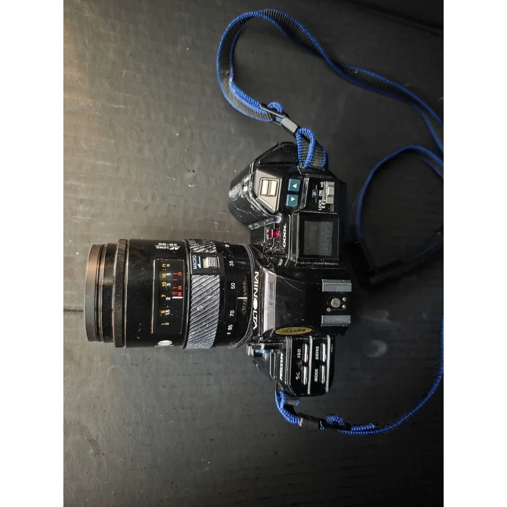 Minolta Maxxum 7000 35mm SLR Film Camera with 28-300, 70-210, and 28-85 Lenses